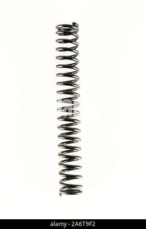 Gray metal spring on a white background Stock Photo