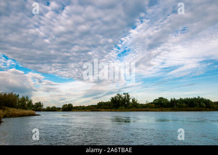 Beautiful Stratocumulus clouds in the Netherlands at the river the IJssel nearby the city Deventer Stock Photo