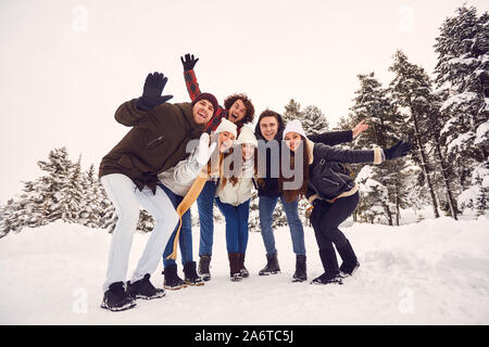 People having fun on the snow in nature in winter Stock Photo