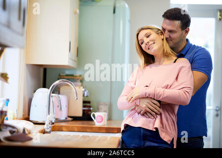 Happy couple cuddling each other Stock Photo
