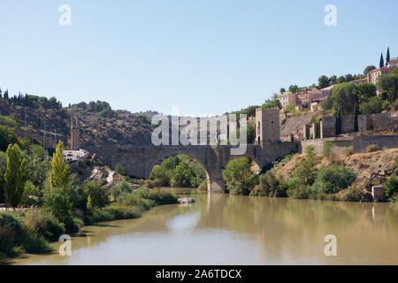 The Puente de Alcántara over the Tagus River in Toledo in Spain Stock Photo