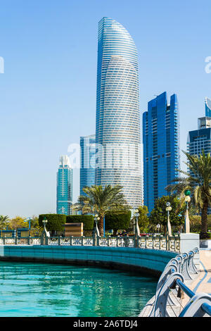 Abu Dhabi Corniche walking area with landmark view of modern buildings on Corniche road, UAE Stock Photo