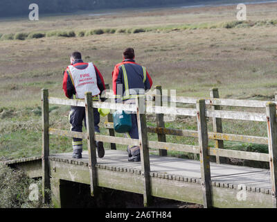 Coastguard service members aid Ambulance and police in a body recovery, Newquay Cornwall UK Stock Photo