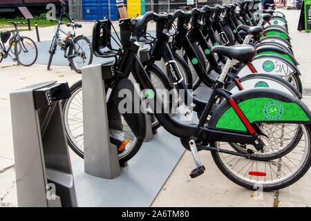 Toronto, Ontario, Canada - SEPTEMBER 27, 2019:  Bike Share Toronto bikes docked at rental station by the CN Tower. Stock Photo