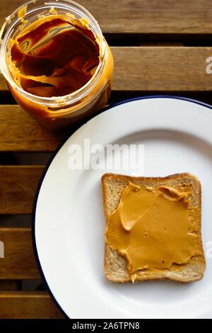 Peanut Butter on Brown Wholewheat Toast Stock Photo