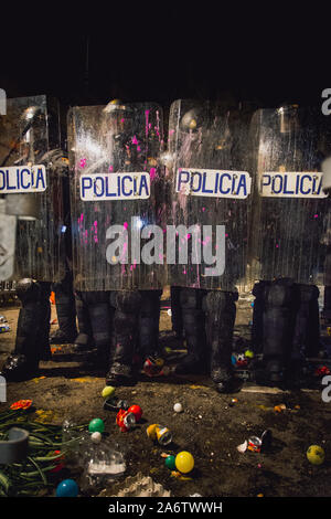 Police during the demonstration in Via Laietana / Comtal Street, Barcelona, Spain. The ground full of what the protesters had thrown at them during th Stock Photo