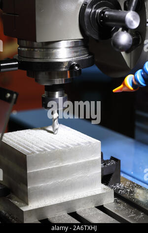 Milling process on CNC milling drilling machine. Selective focus. Stock Photo