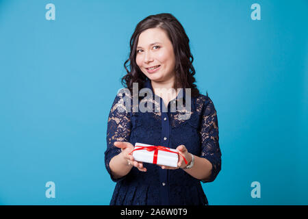 Beautiful Asian woman holds a birthday present Stock Photo