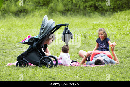 Caravaca, Spain, September 12, 2019: Family spend leisure time in picnic on sunny day at natural park. Families with children and dog pets enjoying th Stock Photo