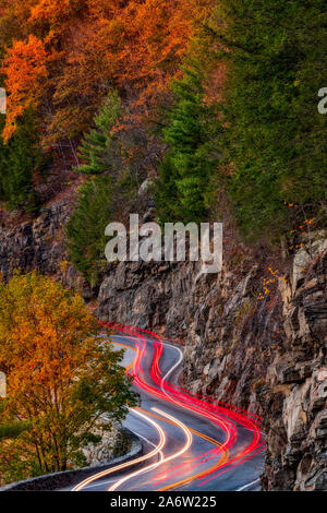 Hawks Nest Route 97- Car trails along the winding route 97 during the autumn foliage season in Sparrow Bush, New York. Stock Photo