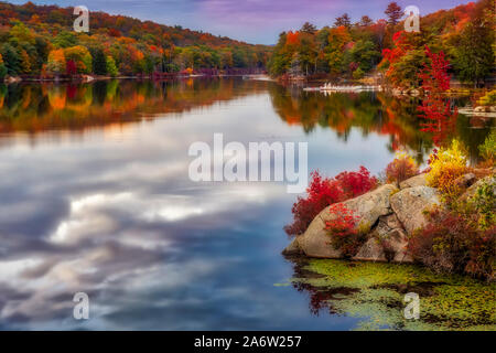 Harriman State Park In Autumn - View to the magnificent colors of fall foliage and reflections on the calm waters at Harriman State Park in New York. Stock Photo