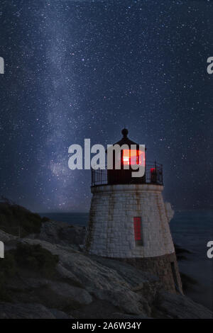 Milky Way Rising Over Castle Hill - A star filled sky with the galactic core of the Milky Way next to Castle Hill Lighthouse on Narragansett Bay in Ne Stock Photo