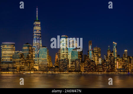 Manhattan NYC Skyline Twilight - The lower Manhattan, New York City skyline during the blue hour of twilight. Stock Photo