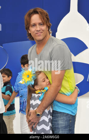 LOS ANGELES, CA. July 28, 2013: Larry Birkhead & Dannielynn Marshall (daughter of the late Anna Nicole Smith) at the Los Angeles premiere of 'The Smurfs 2' at the Regency Village Theatre, Westwood. © 2013 Paul Smith / Featureflash Stock Photo