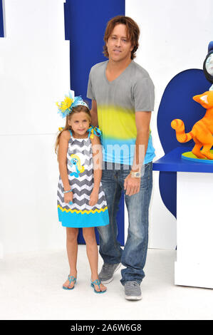 LOS ANGELES, CA. July 28, 2013: Larry Birkhead & Dannielynn Marshall (daughter of the late Anna Nicole Smith) at the Los Angeles premiere of 'The Smurfs 2' at the Regency Village Theatre, Westwood. © 2013 Paul Smith / Featureflash Stock Photo