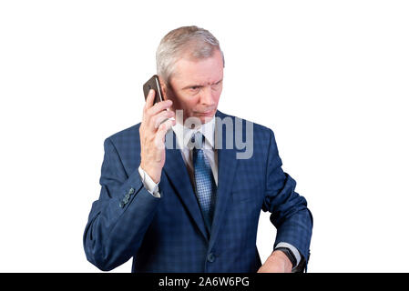 An elderly man in a suit talking on the phone. Isolated on a white background. Stock Photo