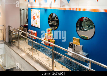 Strasbourg, France - Dec 27, 2017: Multiple perfumes biscuits and toys boxes for sale inside Galeries Lafayette shopping mall Stock Photo