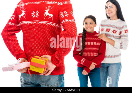 cropped view of man holding presents near wife and daughter isolated on white Stock Photo