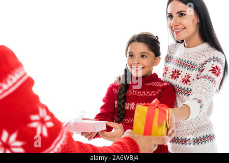 cropped view of man giving presents to wife and daughter isolated on white Stock Photo
