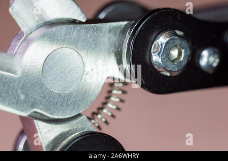 elements small foldable steel multitool, closeup, macro Stock Photo