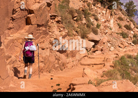 Woman hiking alone on the South Kaibab Trail in the Grand Canyon Stock Photo