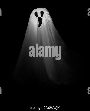 White Ghost on Black Background. Stock Photo