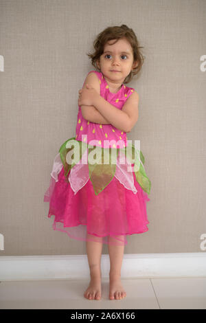 Young cute girl against concrete wall at home Stock Photo