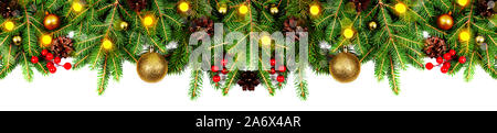 Amazing christmas border with fresh fir branches isolated on white. Golden balls, fir branches, cones, little light and red berries composition. Stock Photo