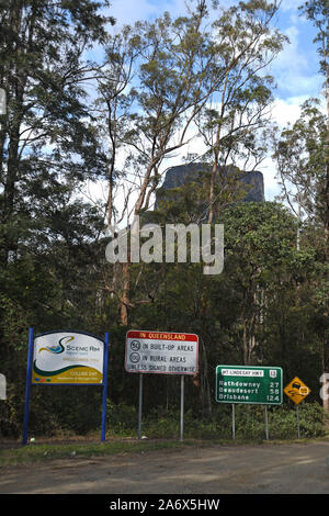 Signage for the border between Queensland and New South Wales near Mount Lindsey, seen through the trees Stock Photo