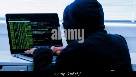 Hacker typing fake dummy code Stock Photo