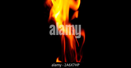 Fire texture isolated on black background. Fire flames on black background. Fire patterns. Texture of flames throughout the space. Red flames up close Stock Photo