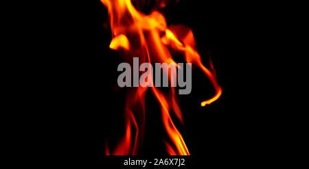 Fire texture isolated on black background. Fire flames on black background. Fire patterns. Texture of flames throughout the space. Red flames up close Stock Photo
