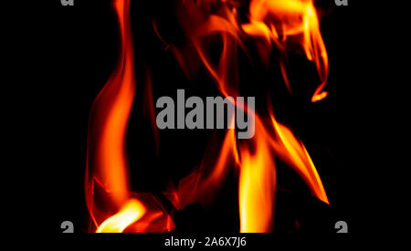 Fire texture isolated on black background. Fire flames on black background. Fire patterns. Texture of flames throughout the space. Red flames up close Stock Photo