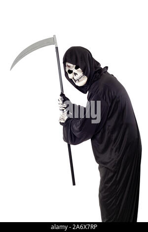 The grim reaper or death halloween costume isolated on a white background.  The skeleton is wearing a hooded black robe. Side view in profile for comp Stock Photo