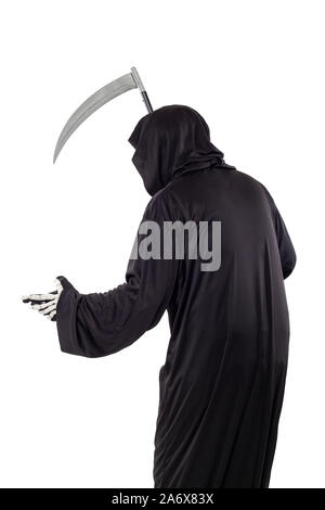 The grim reaper or death halloween costume isolated on a white background.  The skeleton is wearing a hooded black robe. Side view in profile for comp Stock Photo