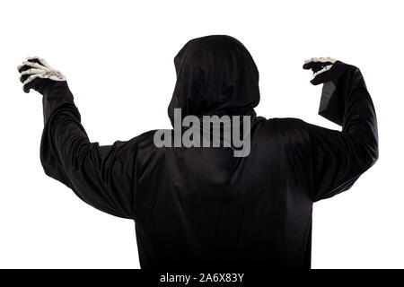 The grim reaper or death halloween costume isolated on a white background.  The skeleton is wearing a hooded black robe. Side view in profile for comp Stock Photo