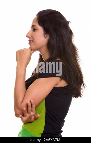 Profile view of happy Persian woman smiling while thinking Stock Photo