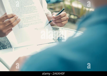 agent showing car insurance to lender. salesman dealer presenting purchase order contract to customer. Stock Photo