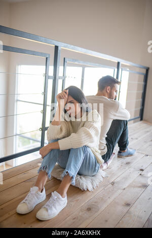 Wife having headache after disagreement with husband Stock Photo