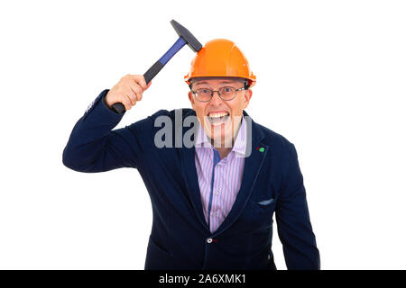 man hits himself with hammer on protective helmet Stock Photo