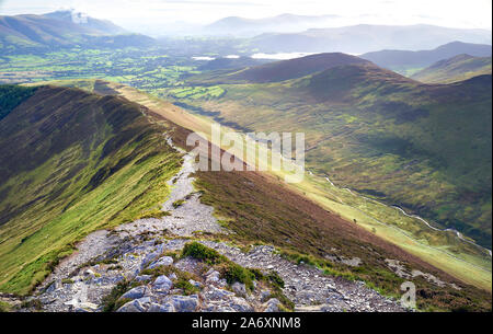 Views down Sleet How from Grisedale Pike with the small town of Braithwaite in the distance In the Lake District, England, UK. Stock Photo