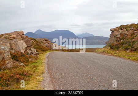 A view of Raasay and the Isle of Skye from the Bealach na Ba road descending into Applecross, Wester Ross, Scotland, United Kingdom, Europe. Stock Photo