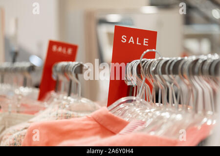 signs with words sale in stores on hangers Stock Photo