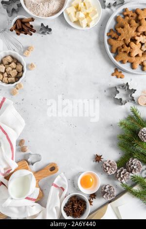 Christmas or Xmas baking culinary background. Ingredients for cooking on kitchen table. New Year or Noel holiday festive decorations Stock Photo