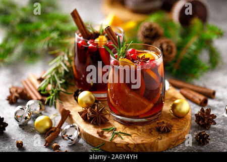 Christmas mulled wine. Traditional Xmas festive drink with decorations and fir tree Stock Photo