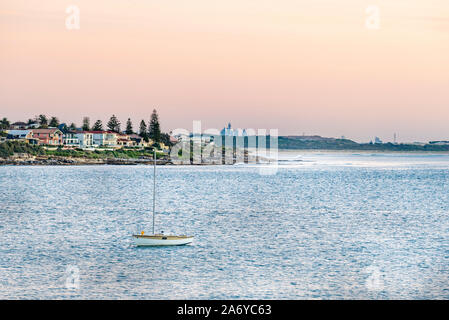 Looking across Port Hacking to Hungry Point, Cronulla in the early morning from Bundeena in southern Sydney, with the city's CBD in the far distance Stock Photo