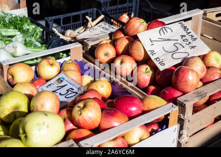 Red apples in wooden crates for sale by weight in an open market Stock Photo