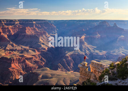 USA, Arizona, Grand Canyon National Park (South Rim), Yavapai Point, Hiker on Cliff Edge (MR) Stock Photo