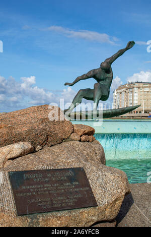 Coruna / Spain - October 23 2019: Bronze sculpture of surfer in a fountain in Riazor Coruna Spain Stock Photo