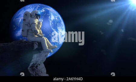 astronaut sitting on a cliff on the Moon in front of planet Earth Stock Photo